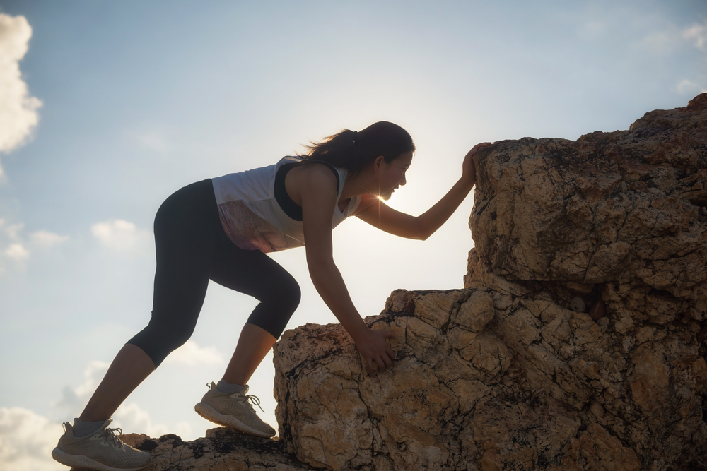 Female,Climber,Hiking,Up,To,Top,Hill,During,Sunset.,Sporty