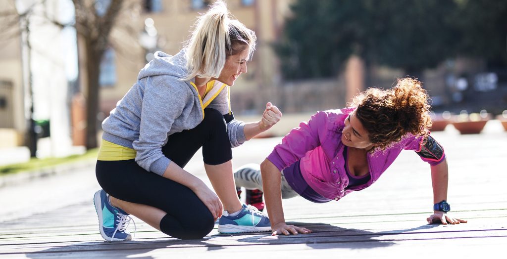 Two ladies, one training the other