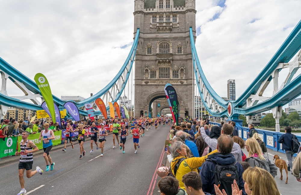 Runners,Completing,The,41st,London,Marathon,Running,Over,Tower,Bridge.