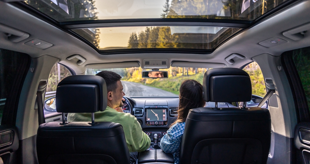 Man,And,Woman,Traveling,In,Car,,Sitting,In,Car,Driving